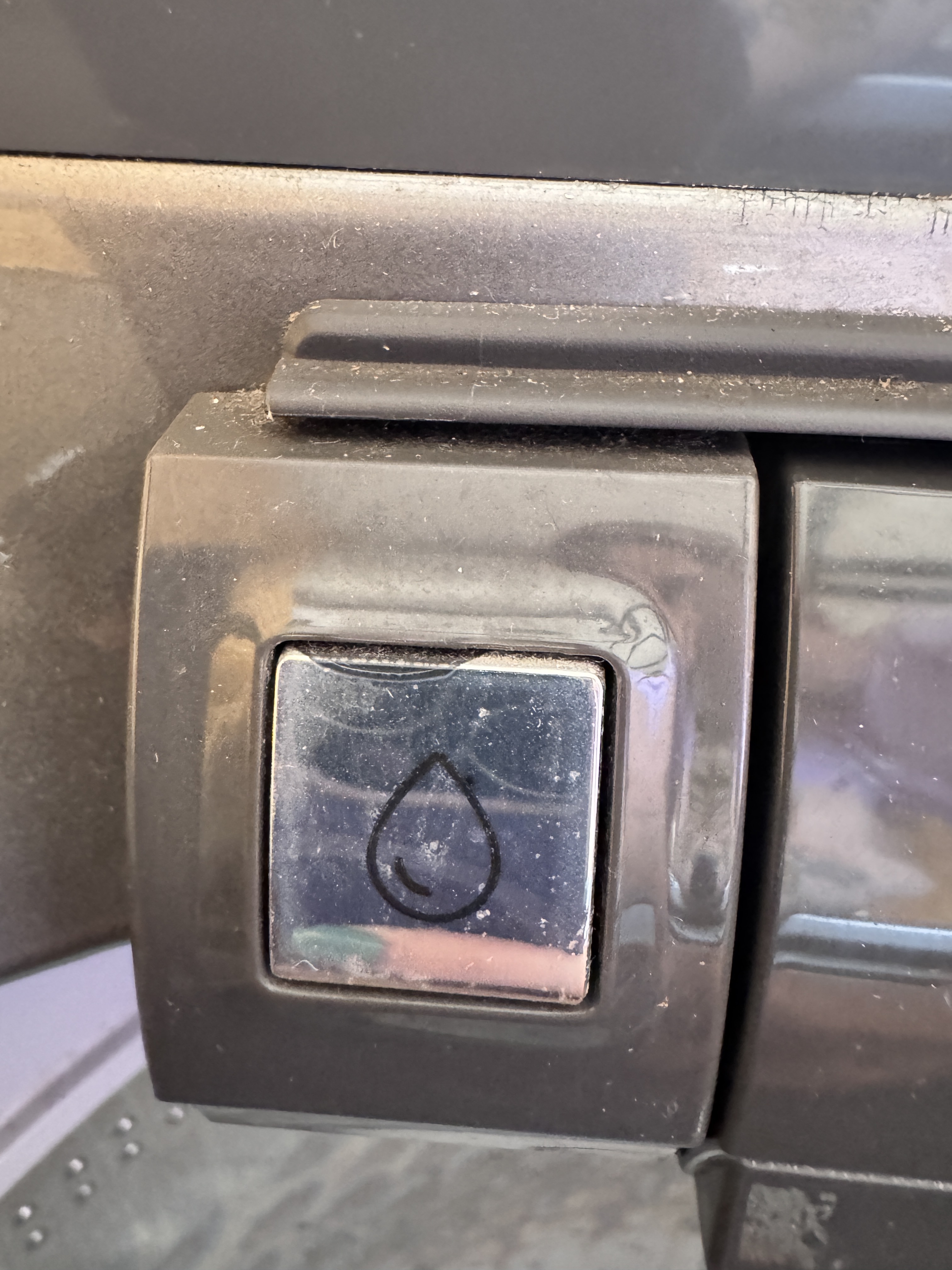 Close-up of the Water Faucet button showing a water-drop icon